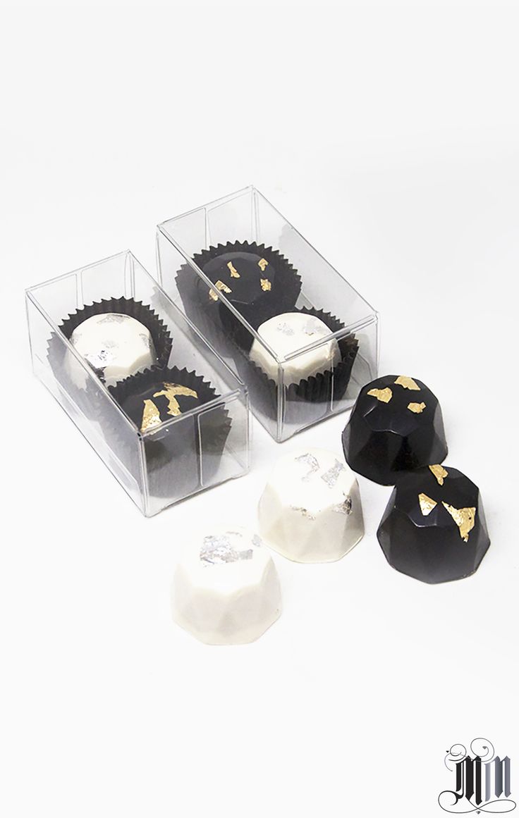 Black and white diamond truffles with gold leaf in clear box