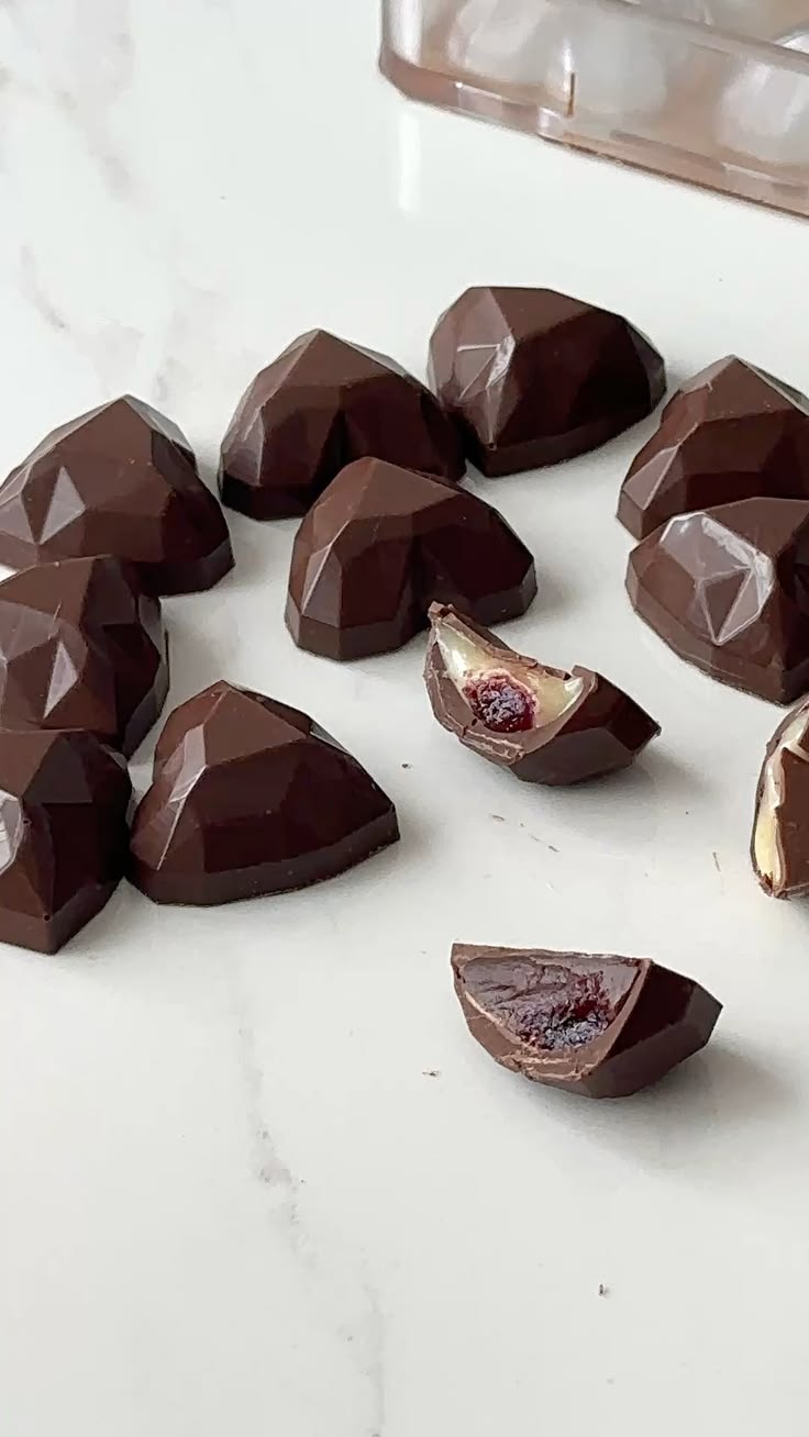 Dark chocolate diamond hearts with cherry filling cross-section