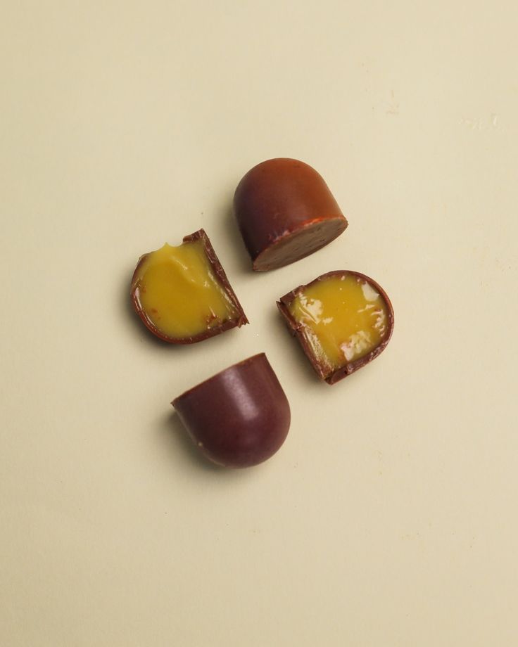 Ruby chocolate dome with mango filling, cross-section